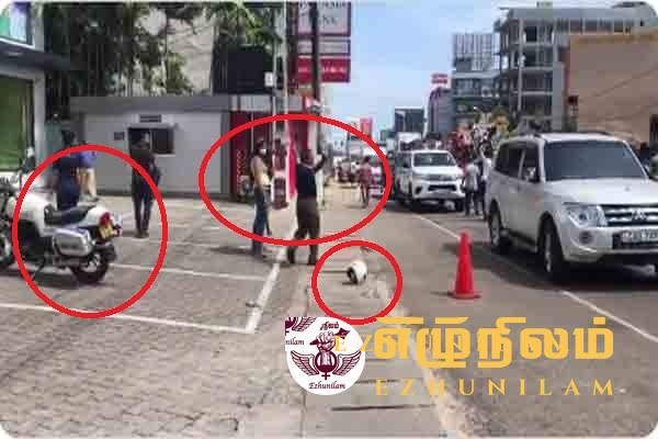 தலைக்கவசத்தை கழற்றி வீசி பேரணியில் இணைந்த பொலிஸ்